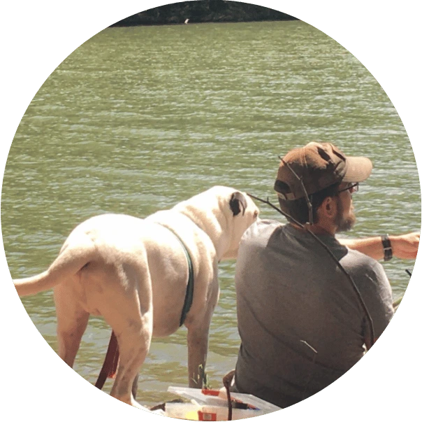 Blake, Founder of Scoopin Poop and dog at lake